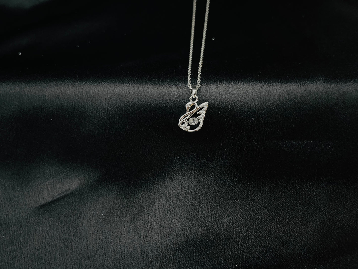 Elegant Silver-Tone Pendant Necklace with Wing-Inspired Design