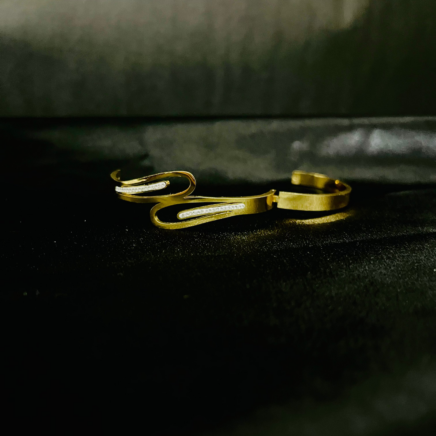 Elegant Gold-Plated Wave Bracelet with Crystal Detailing